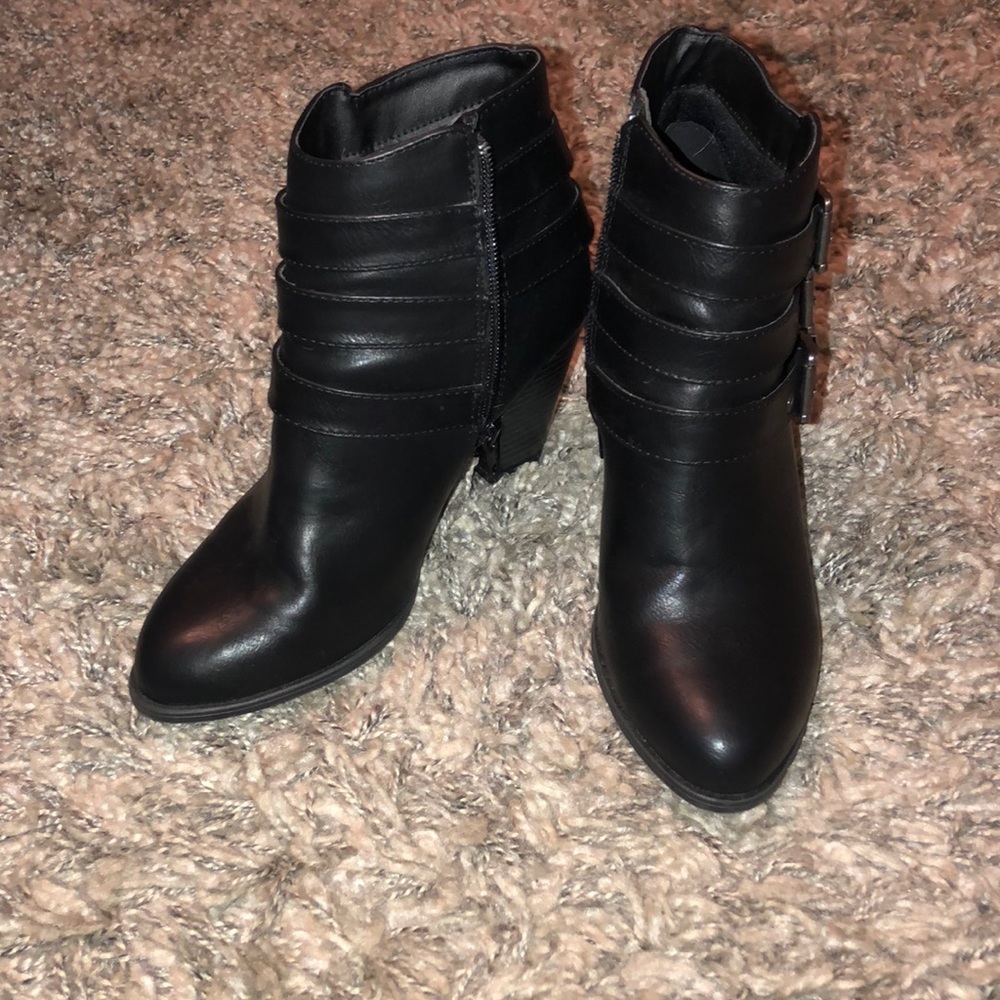 Black heeled buckle booties